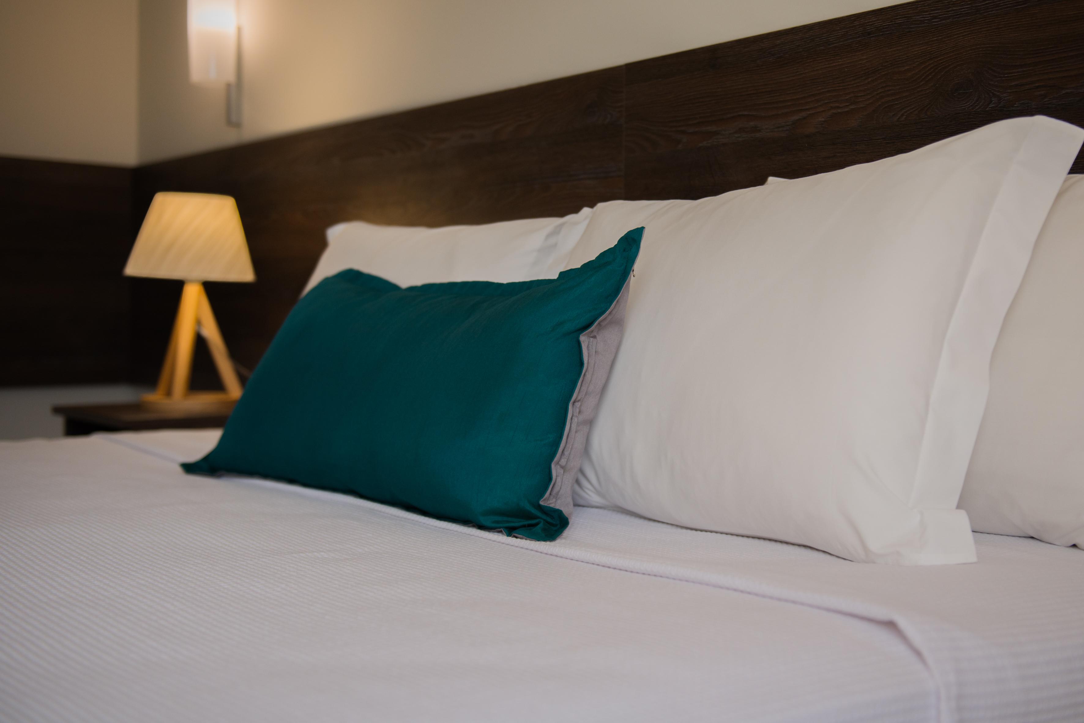 Wish Natal Hotel Exterior photo Pillows on a bed