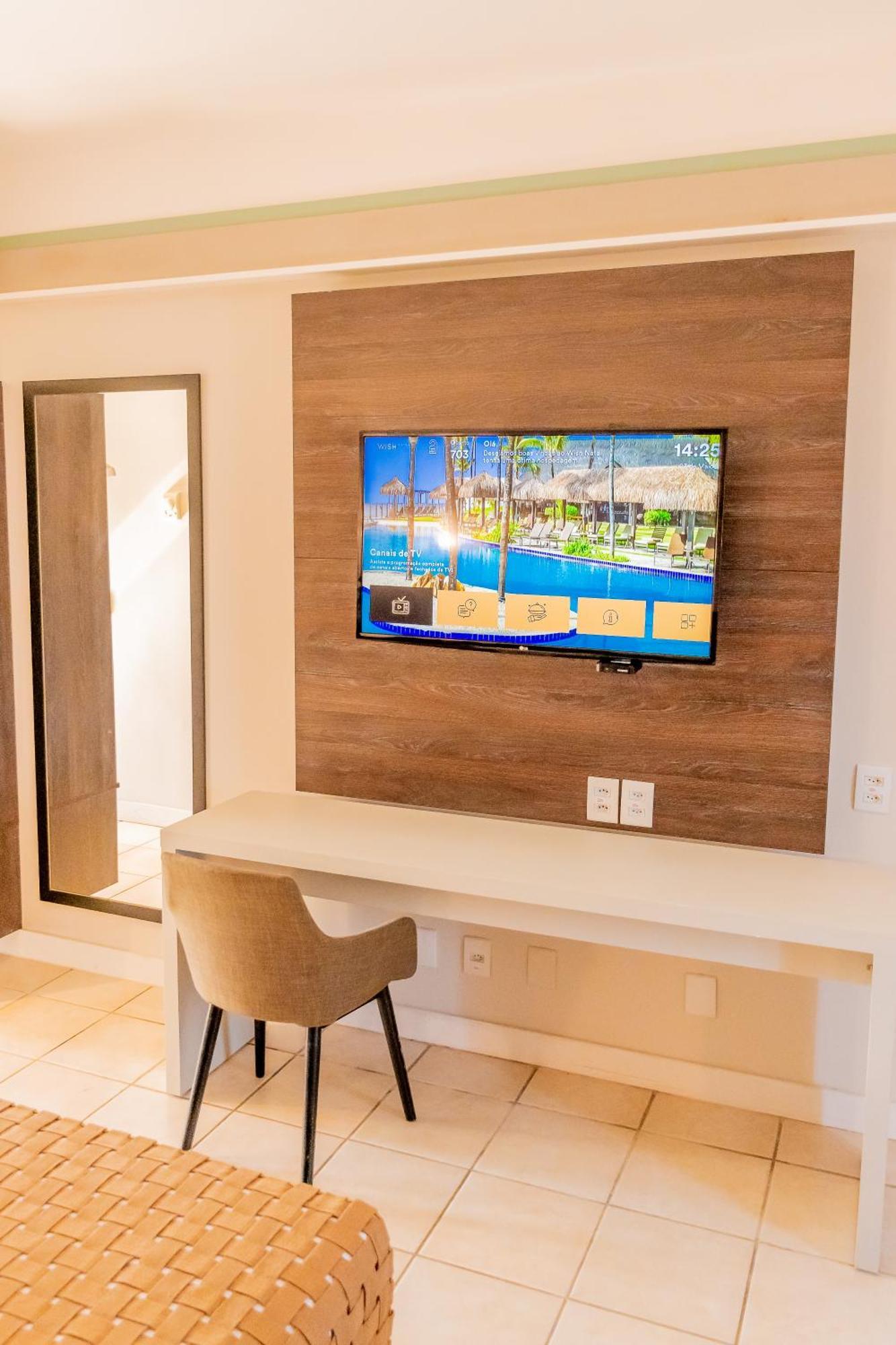 Wish Natal Hotel Exterior photo A television in a hotel room